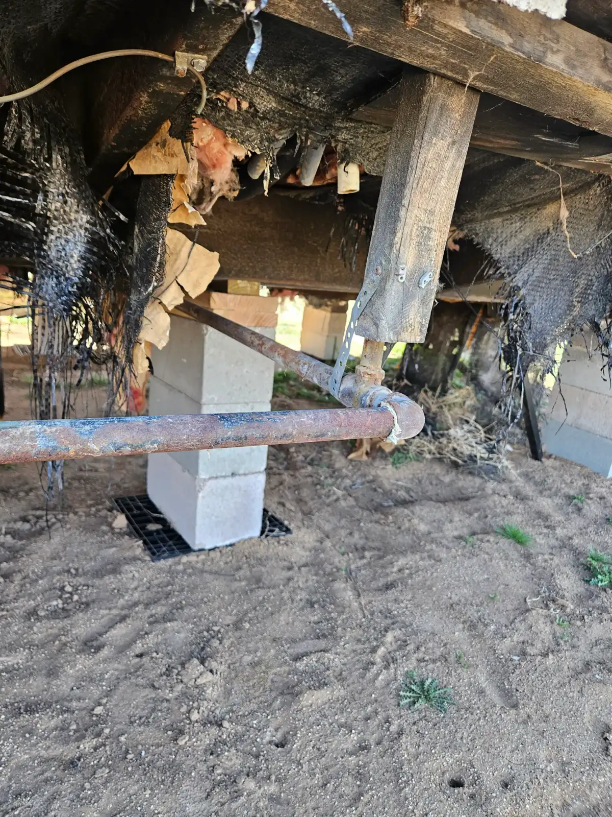 Mobile home gas line installation underneath a manufactured home by Armor Heating & Cooling